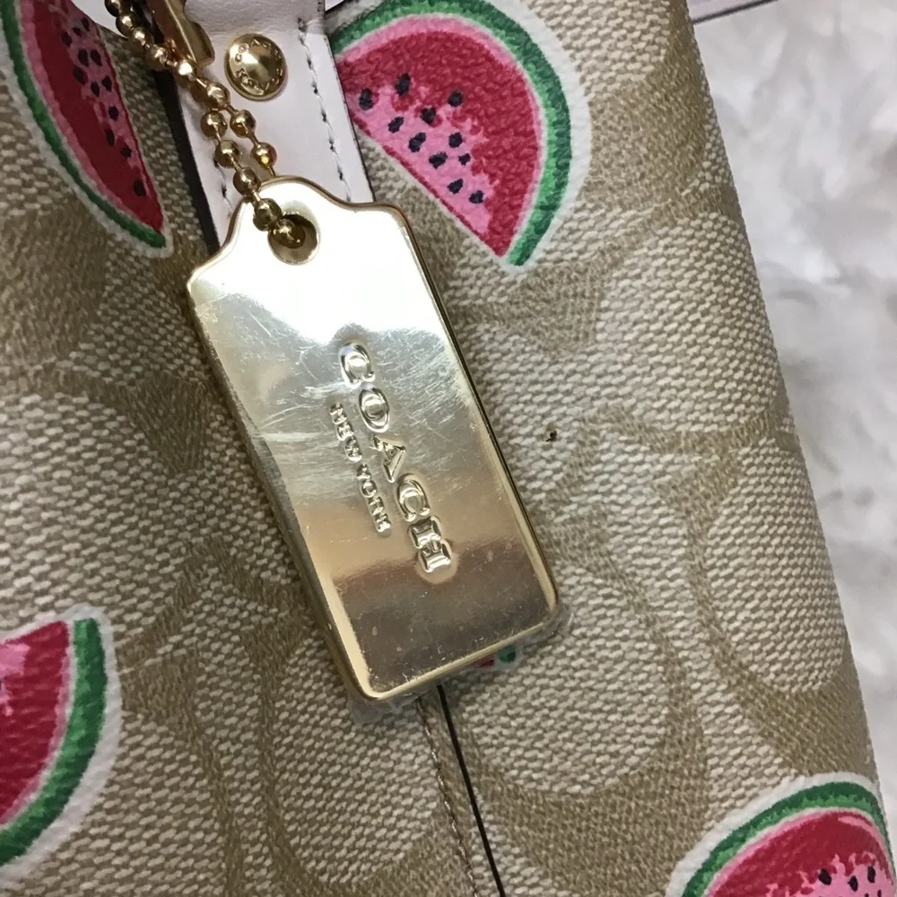 Coach Small Town Bucket Bag in Signature Canvas with a watermelon print. EUC - Picture 14 of 16